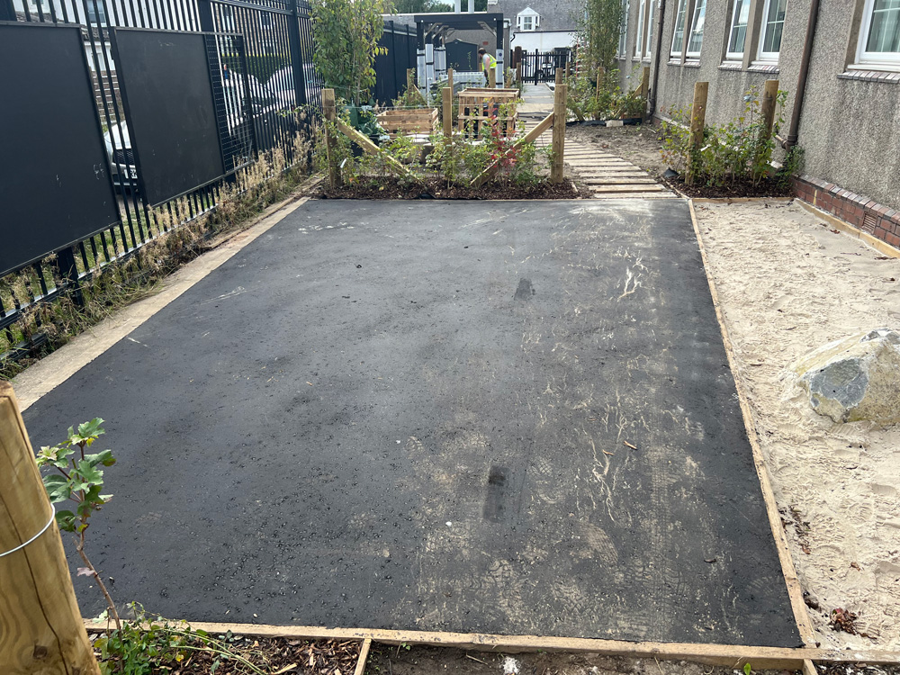 small playing area with tarmac