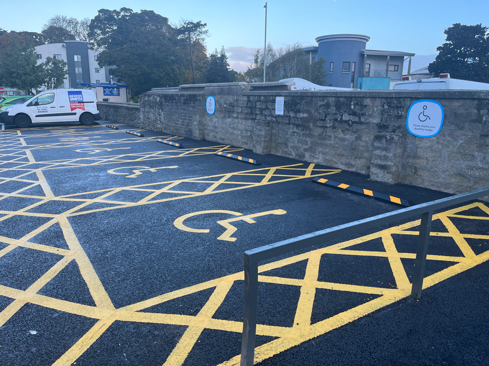 Yellow painted disabled parking bays 